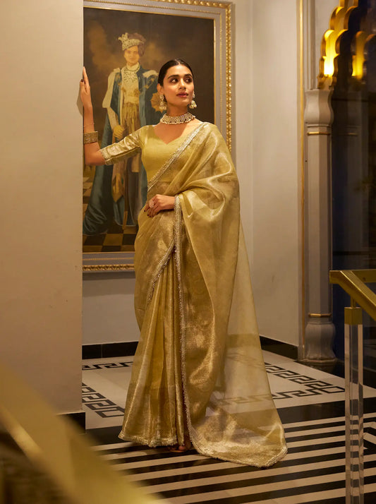 Golden Shimmer Tissue Saree With Zari Weaving Work & Sequins Lace Border