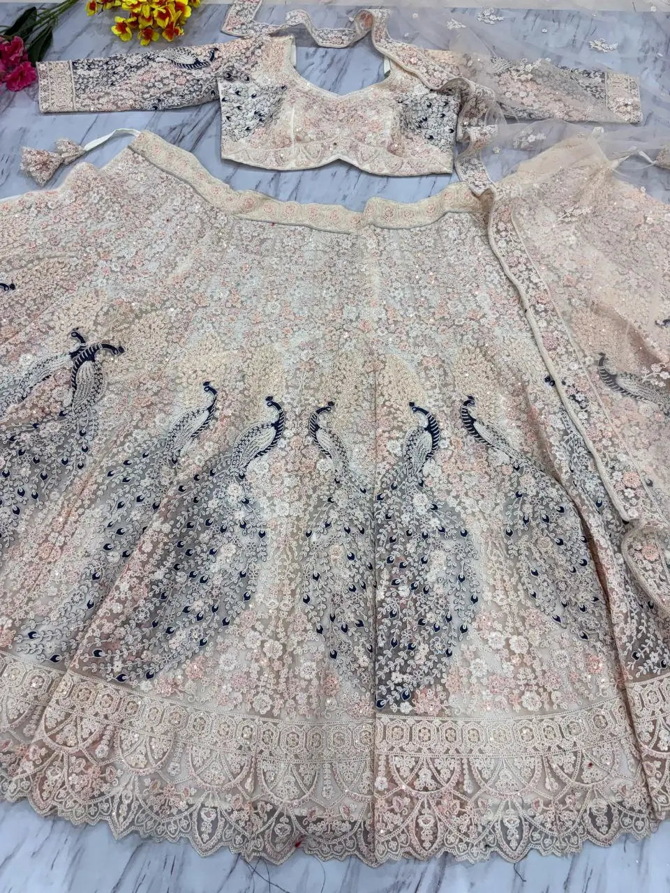 Light Peach Soft Net Lehenga With Multi Thread Sandwich Sequins Embroidery Work