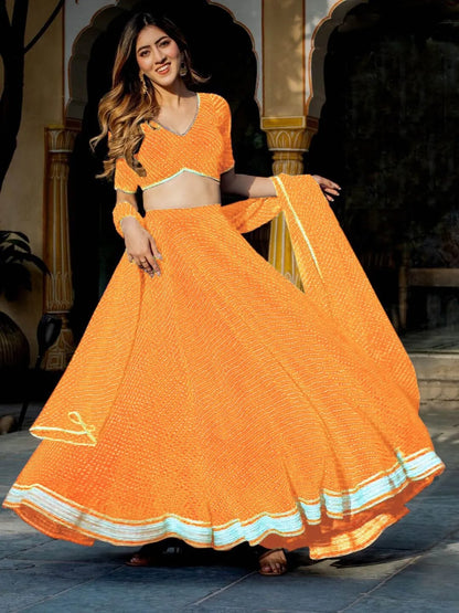 Stunning Yellow Georgette Leheriya Print Lehenga With Zari And Cording Lace Work