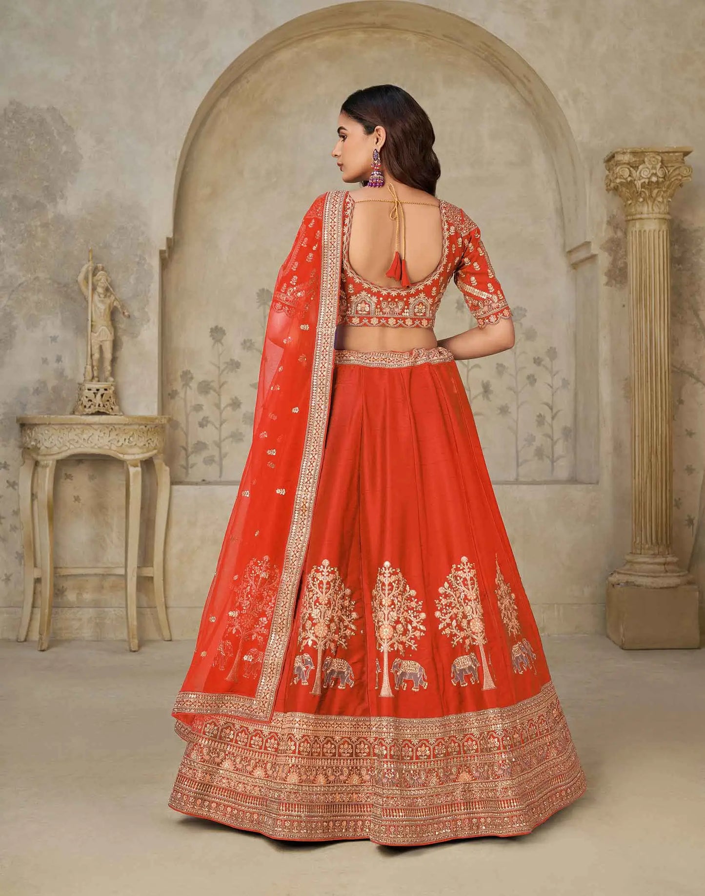 Trendy Rust Wedding Lehenga With Elephant Motifs