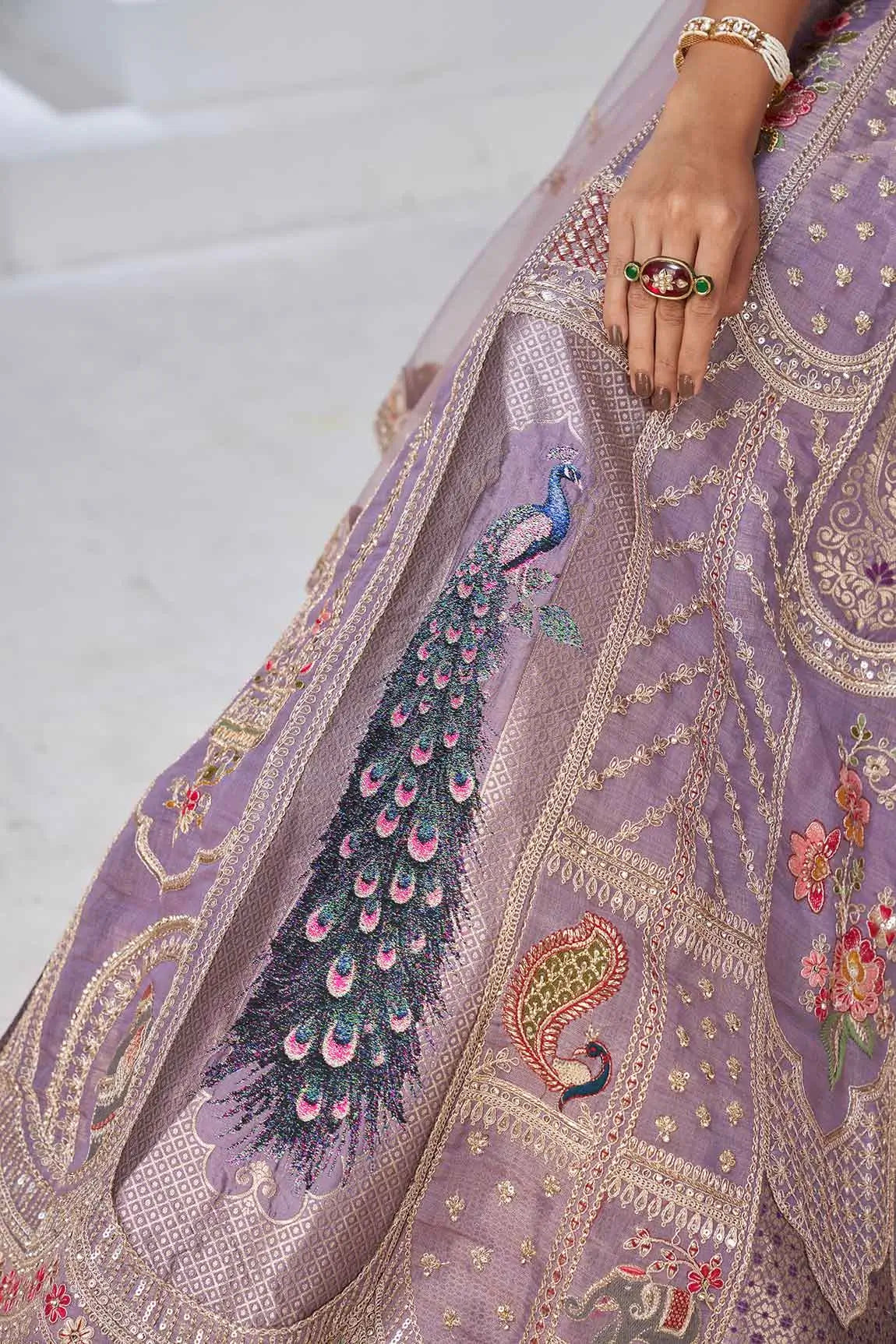 Dusky Purple Silk Lehenga With Peacock Feather Motifs