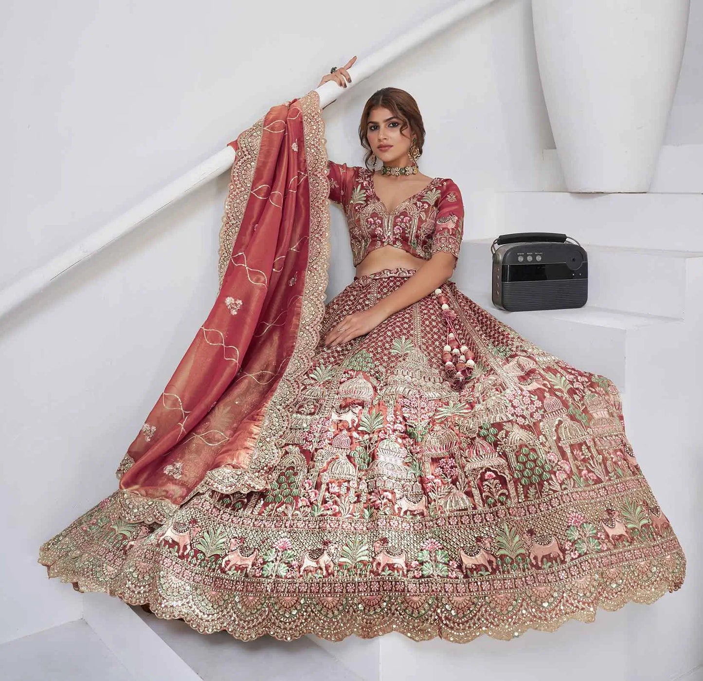 Pinkish Red Bridal Lehenga With Temple & Cow Motifs