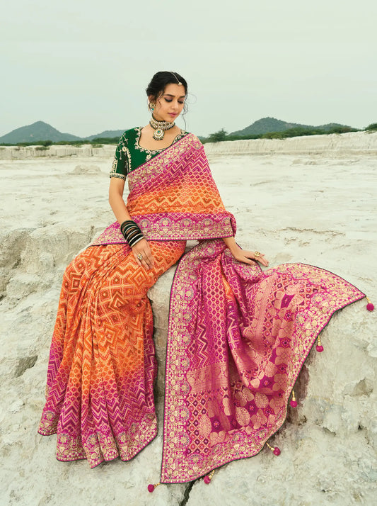 Orange-Rani pink Georgette Heavy Embroidered Bandhej Saree