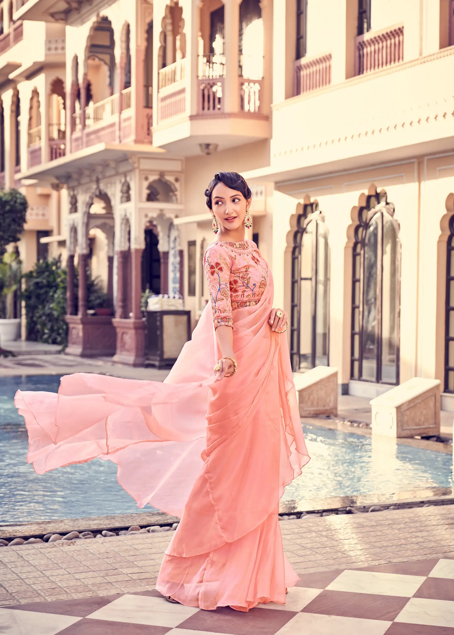 Peach Pink Organza Ruffle Saree With Embroidered Blouse