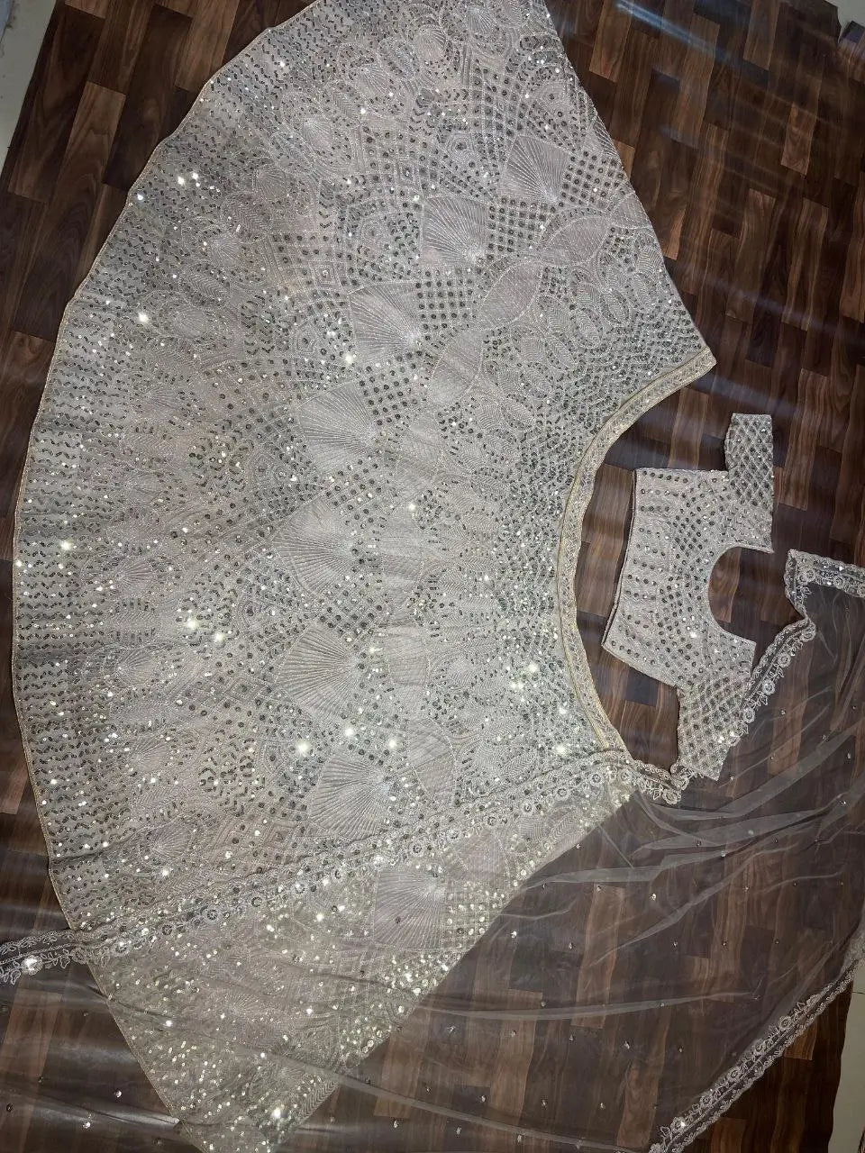 Off White Net Lehenga Embellished With Heavy Sequins And Heavy Dori Work