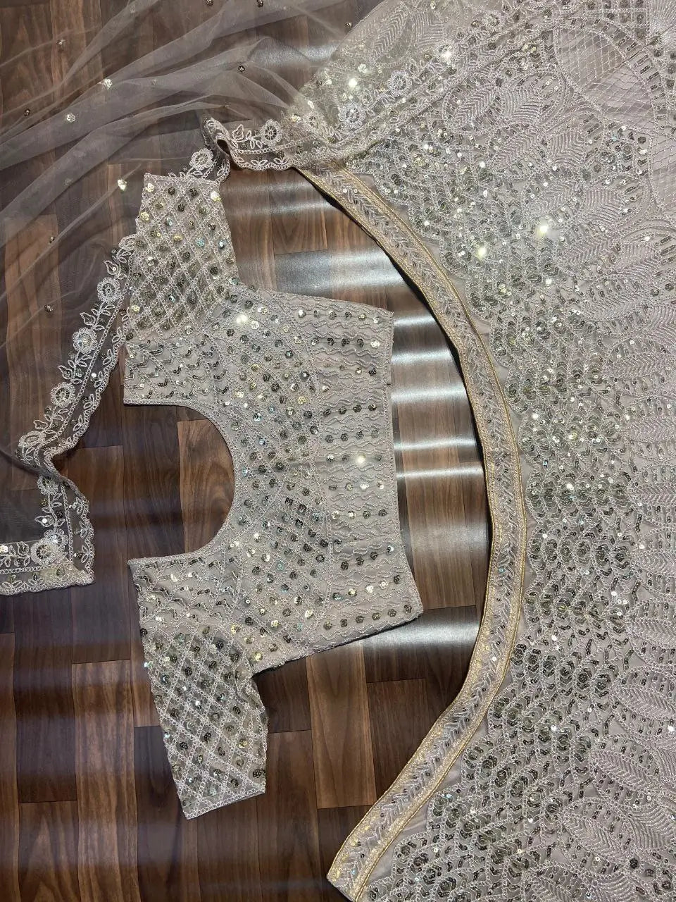 Off White Net Lehenga Embellished With Heavy Sequins And Heavy Dori Work