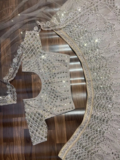 Off White Net Lehenga Embellished With Heavy Sequins And Heavy Dori Work