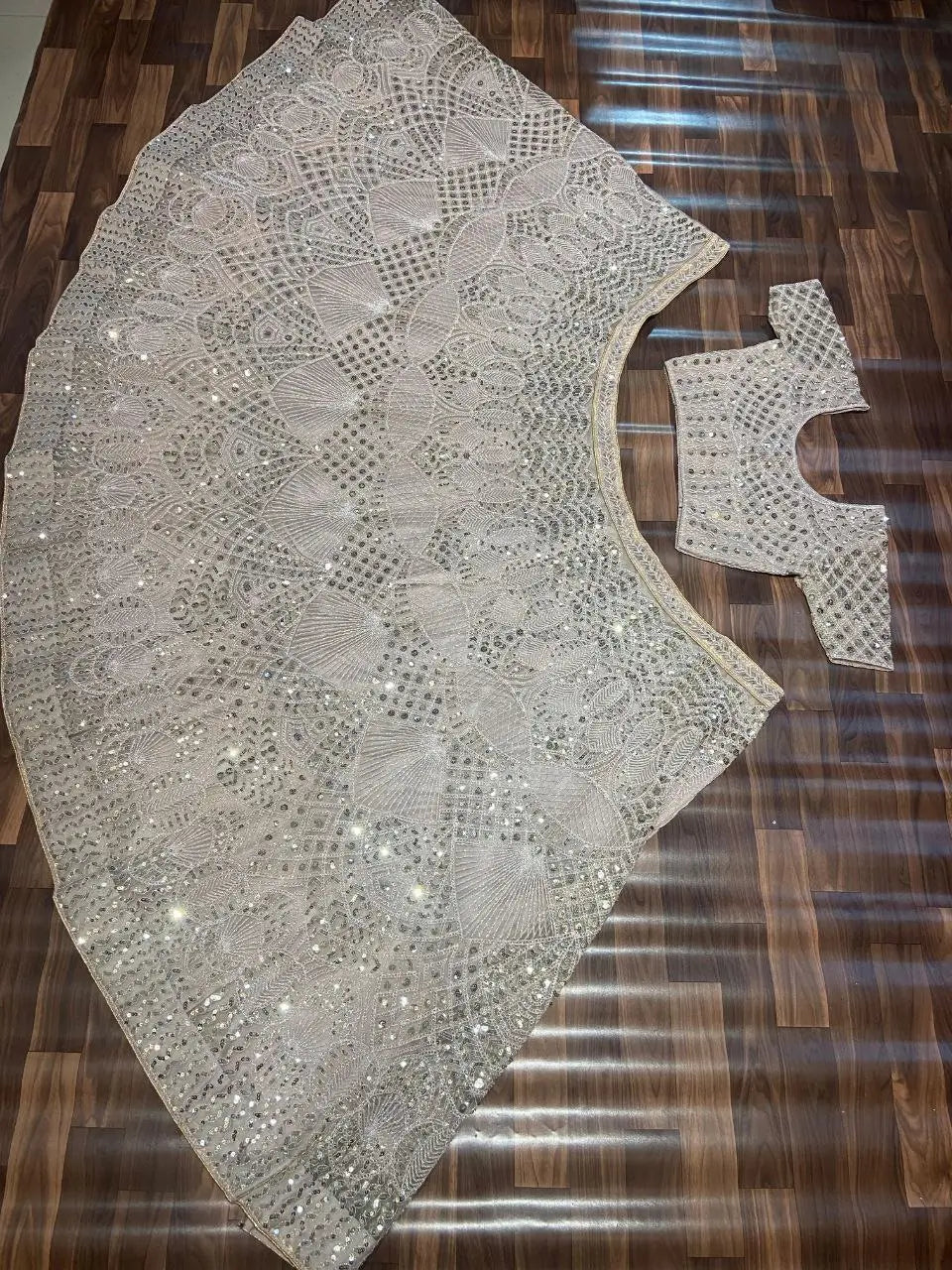 Off White Net Lehenga Embellished With Heavy Sequins And Heavy Dori Work