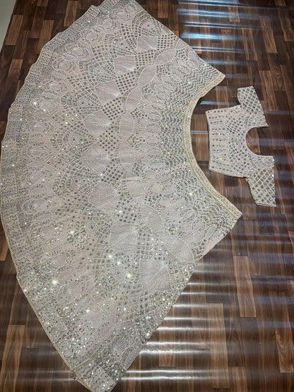 Off White Net Lehenga Embellished With Heavy Sequins And Heavy Dori Work