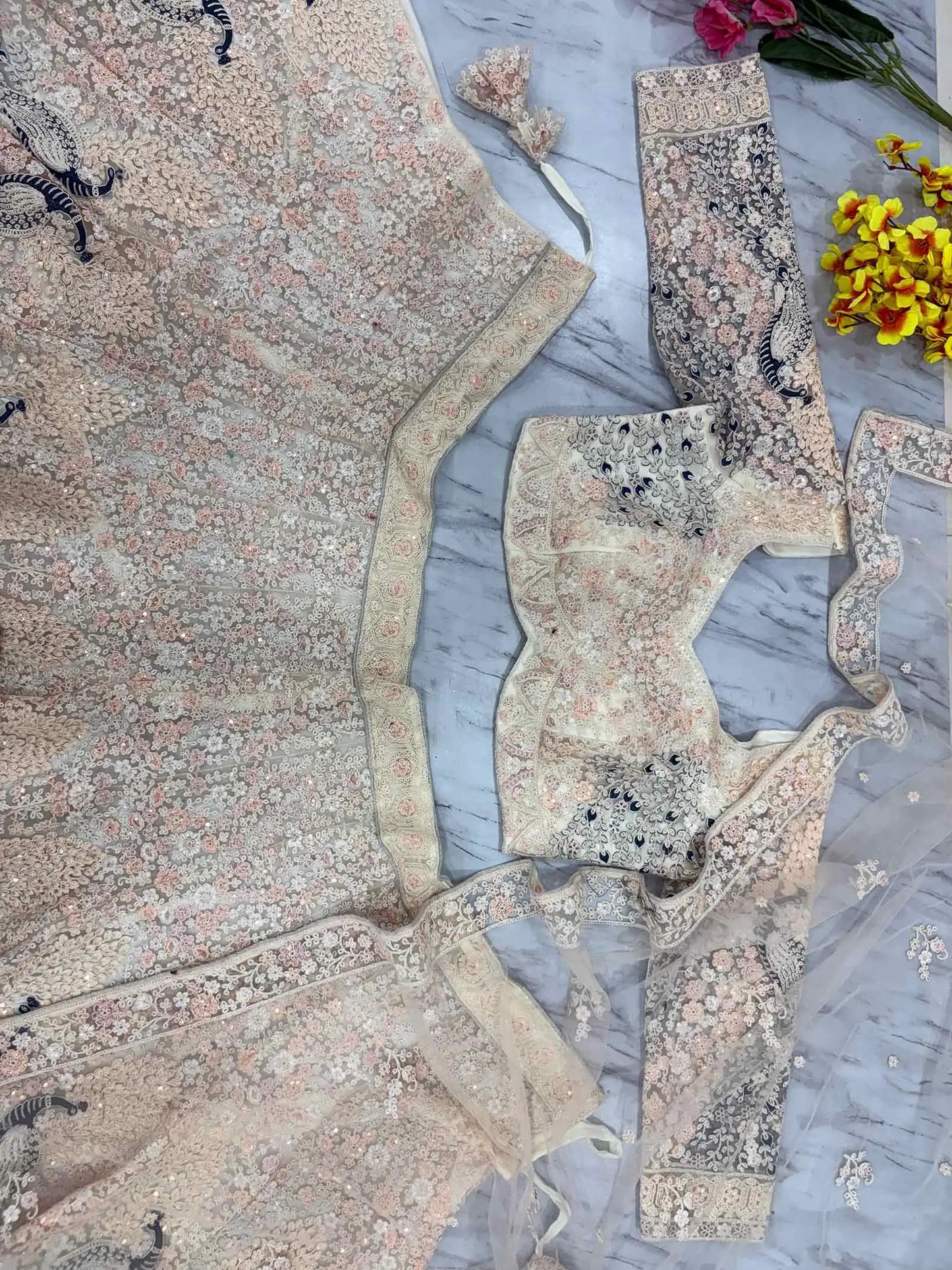 Light Peach Soft Net Lehenga With Multi Thread Sandwich Sequins Embroidery Work