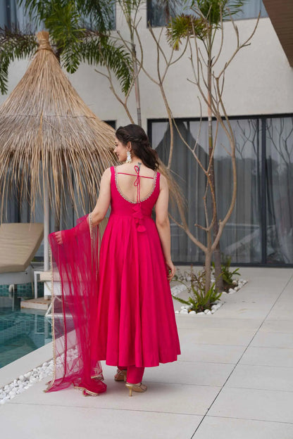 Rani Pink Roman Silk Plain Gown With Mirror Work And Net Dupatta