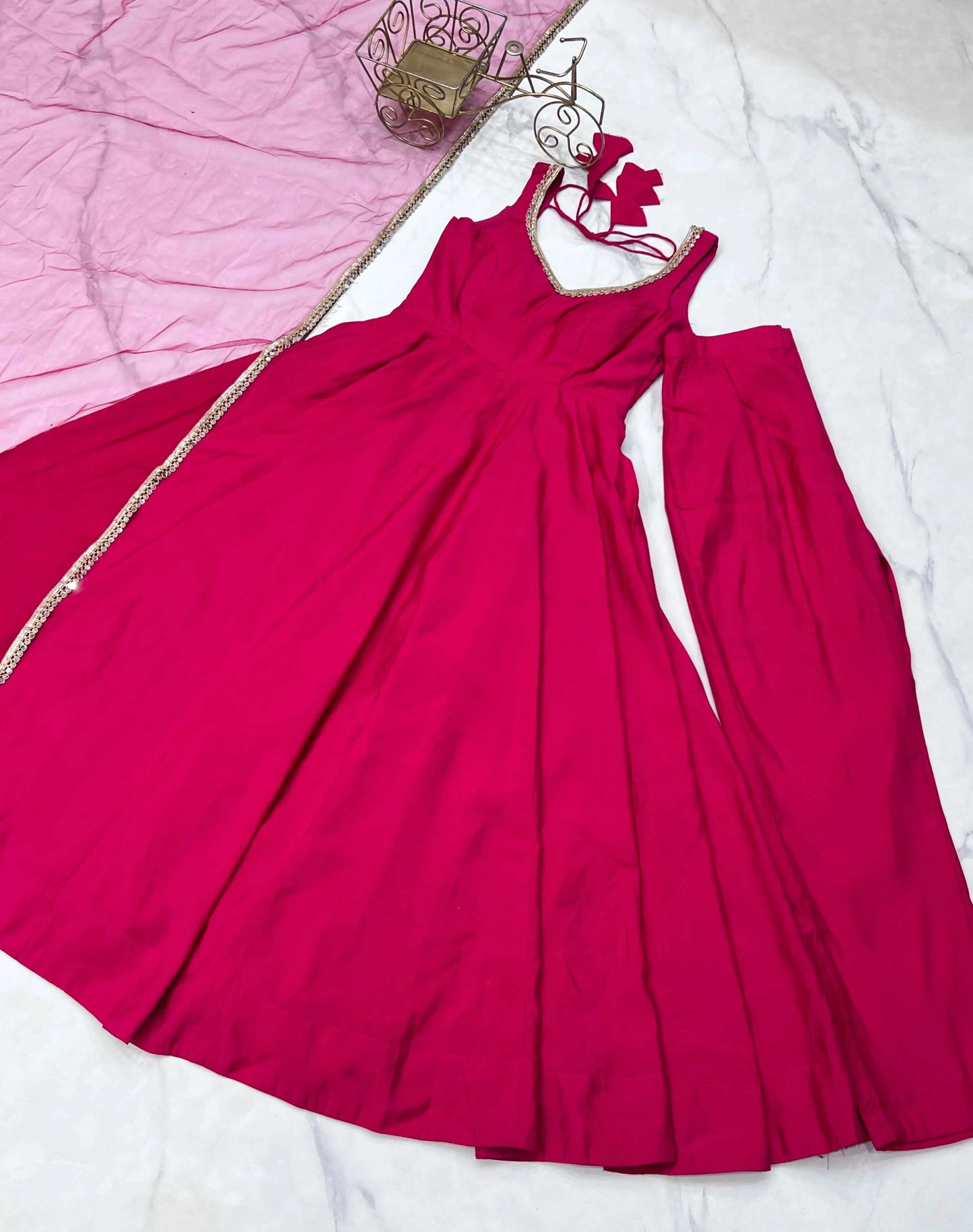 Rani Pink Roman Silk Plain Gown With Mirror Work And Net Dupatta