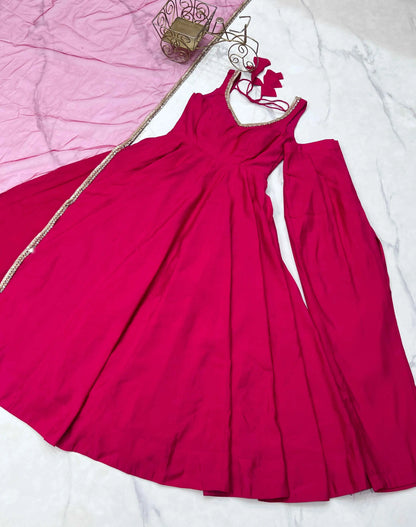 Rani Pink Roman Silk Plain Gown With Mirror Work And Net Dupatta